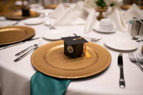 A miniature toga hat on a plate